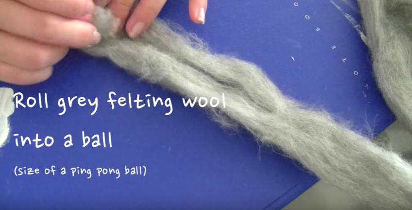roll grey felting wool into a ball