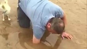 02-man-rescues-dog-from-quick-sand
