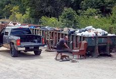 Woman Dumps Crated Dog By Dumpsters, Drives Away & Leaves Pup Scared & Confused