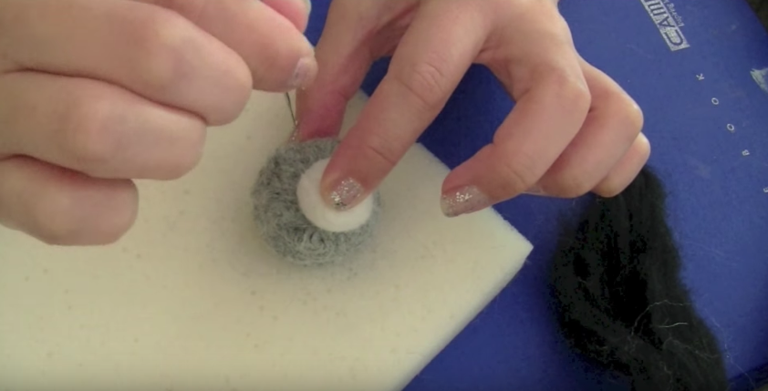 attach grey and white felting wool balls together