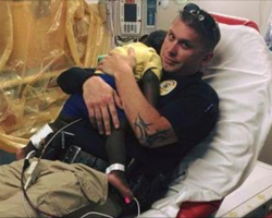 Officer sees abandoned toddler crying frantically, comforts him and holds him in his arms
