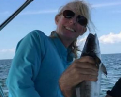 He Took This Photo Of His Wife On A Fishing Trip – But Was Shocked To See This In The Background