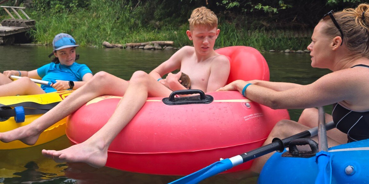 Teen Tubing Down River Reaches Into Water — And A Week-Old Baby Beaver Clings To Him