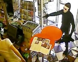 Masked Robber Points Gun At Store Owner, But Dog Comes Charging Out Of Nowhere
