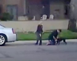 Woman Shoots Dog In Broad Daylight While Man Holds Him Down In Middle Of Road