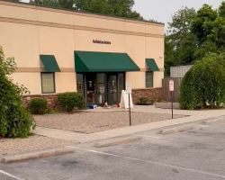Woman Arrives At Work To Find Injured Dog Curled Up On a Delivery Bag Outside